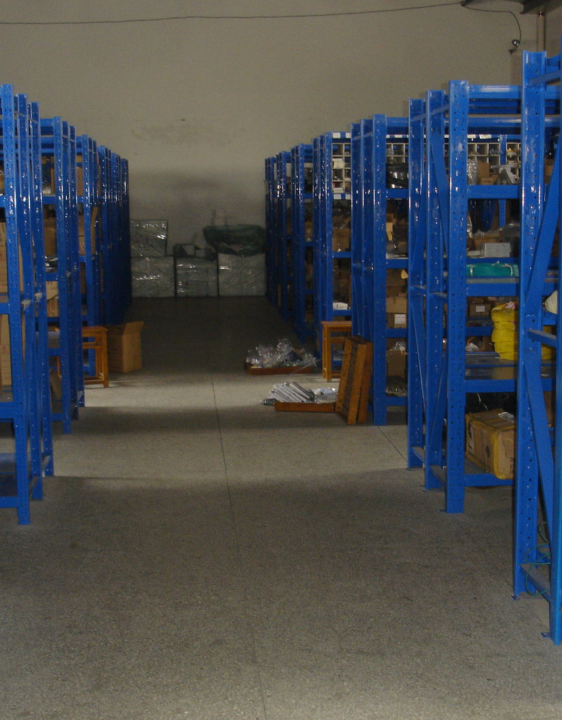 Warehouse aisles and storage racks at a manufacturing partner